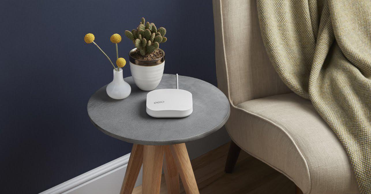 A Mesh wi-fi point installed on a side table.