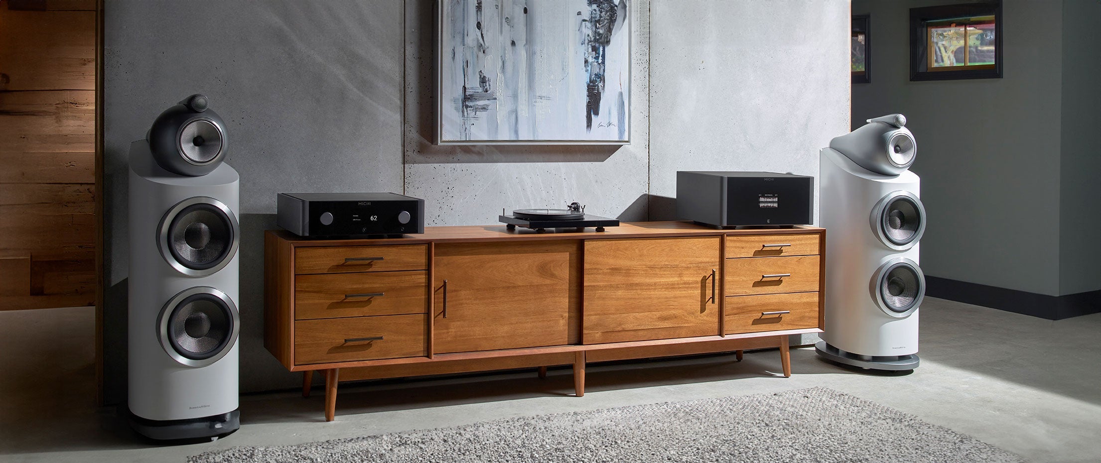 Professional audio system with floor-standing speakers, a/v receiver, and turntable.